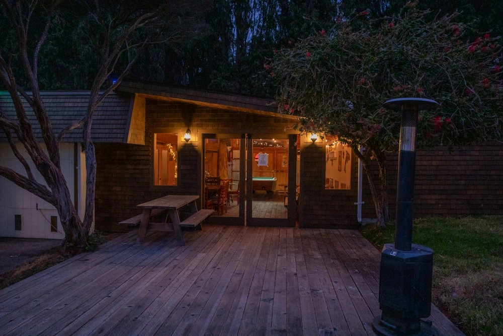Ocean Cove Lodge night pool with illuminated water and lounge area